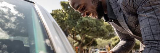 Man approaching his rideshare for an emergency or guaranteed ride home